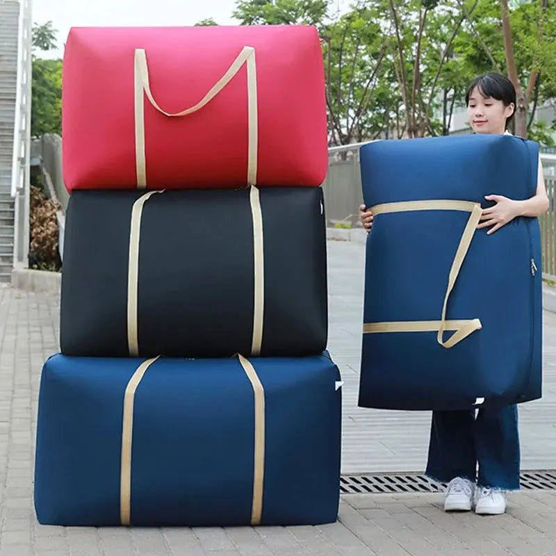 Three stacked blue and red waterproof storage bags being held by a woman outdoors.