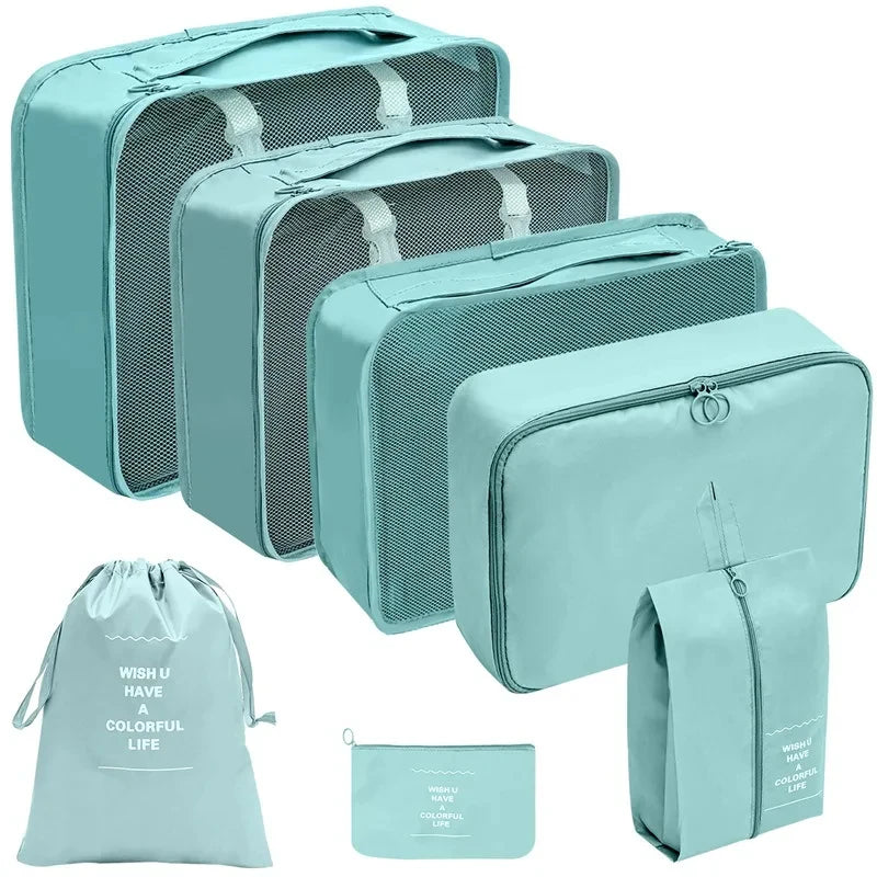 A set of teal fabric storage organizers and a matching drawstring bag for organizing items.