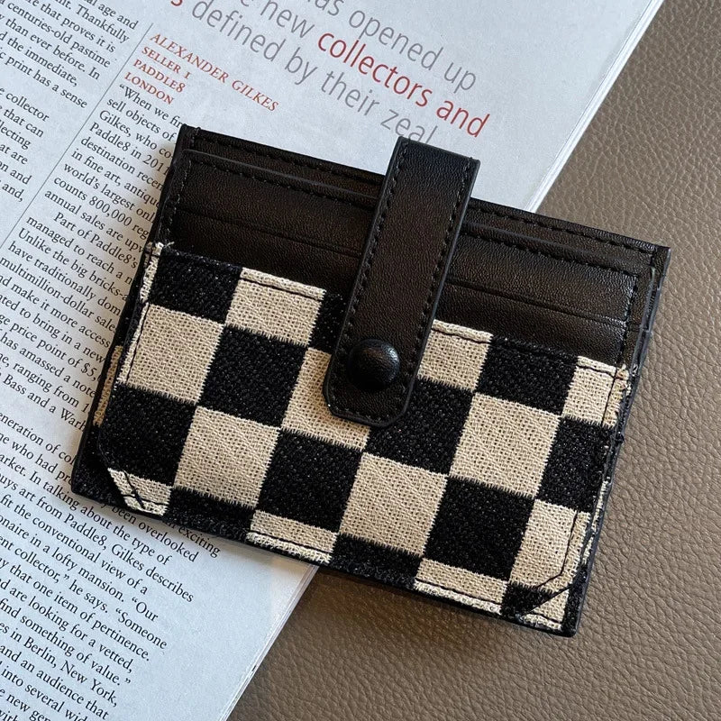 A black and beige checkered PU leather mini card wallet shown against a light background.