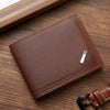 A brown leather wallet with a money clip is shown resting on a wooden surface.
