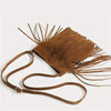 Bolso cruz de borla marrón boho con detalles de flecos largos.
