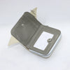A grey Loungefly avatar zipper wallet with a light beige strap and a clear window.