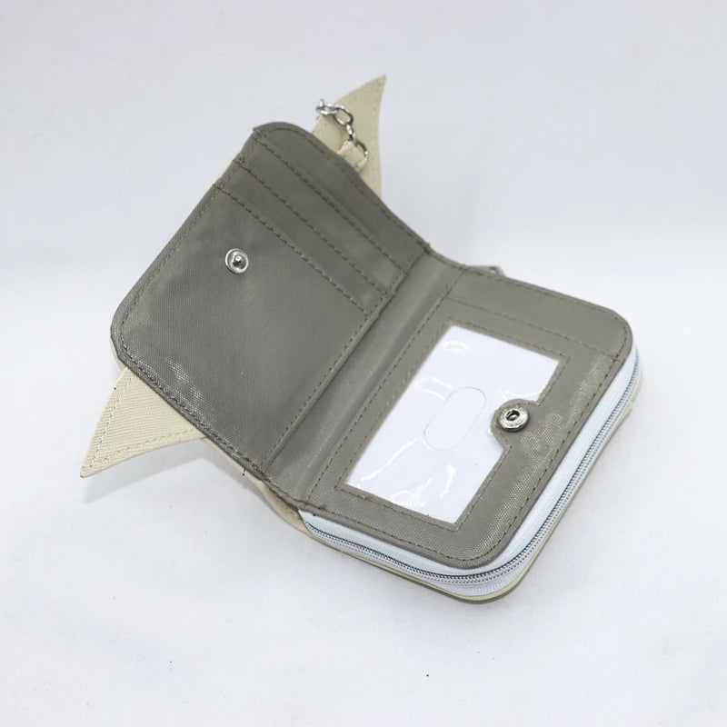 A grey Loungefly avatar zipper wallet with a light beige strap and a clear window.