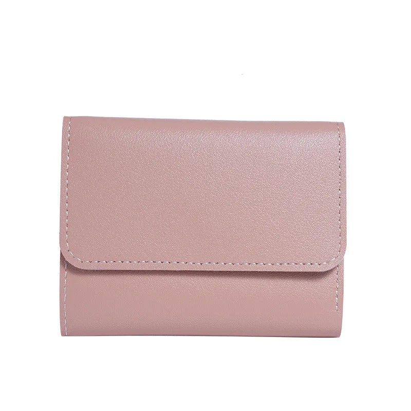 A light pink slim multi-functional card wallet with a stitched edge.
