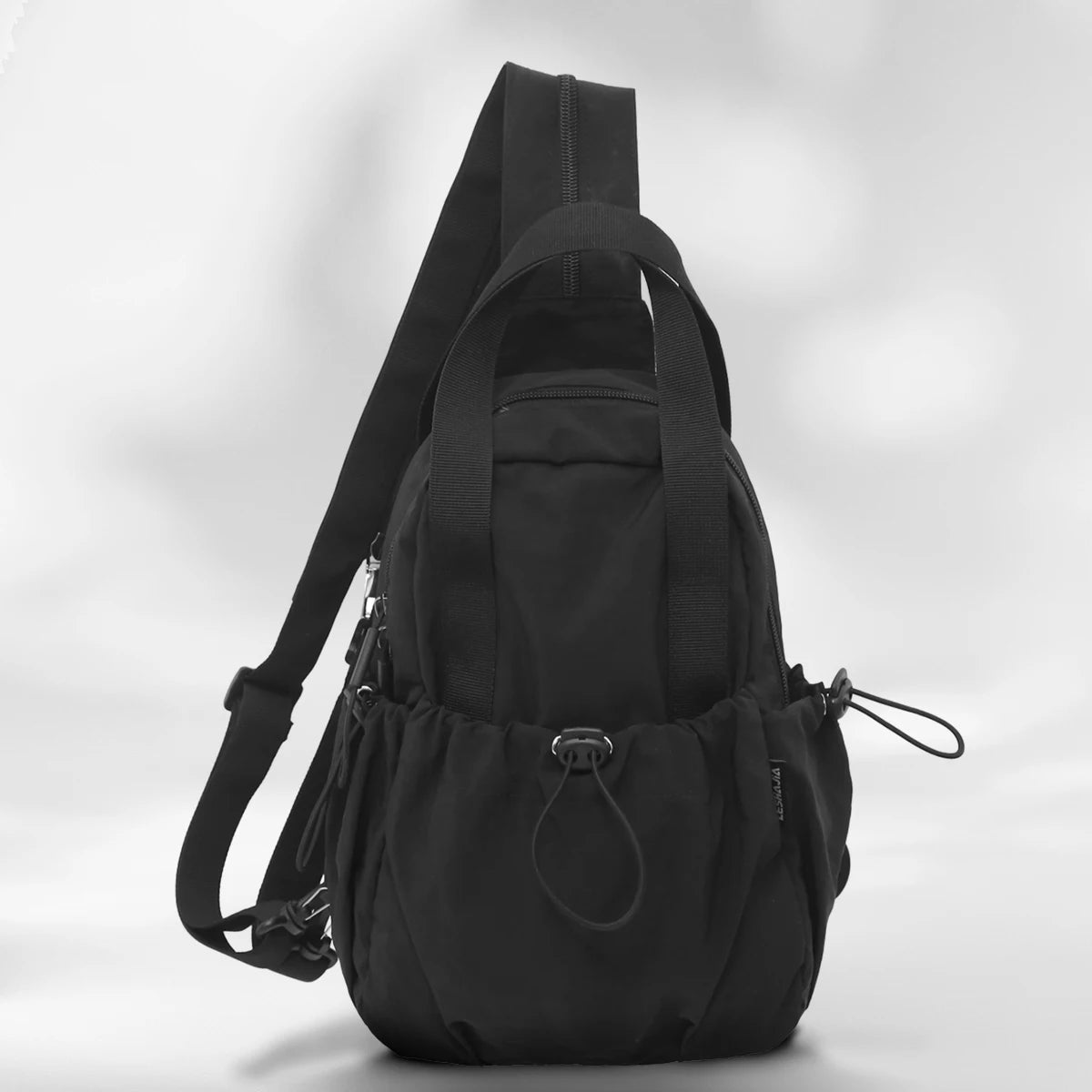 A black versatile casual backpack for women with a laptop compartment shown from the back.