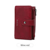 A maroon leather clutch wallet with a flap and zipper closure.