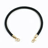 Black braided leather bag handles with gold-toned metal buckles