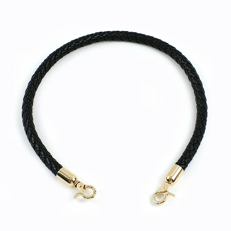 Black braided leather bag handles with gold-toned metal buckles