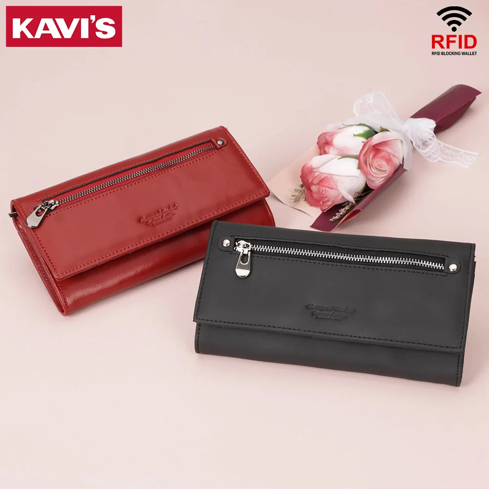 A maroon leather wallet with a zipper and a floral arrangement is displayed on a light background.