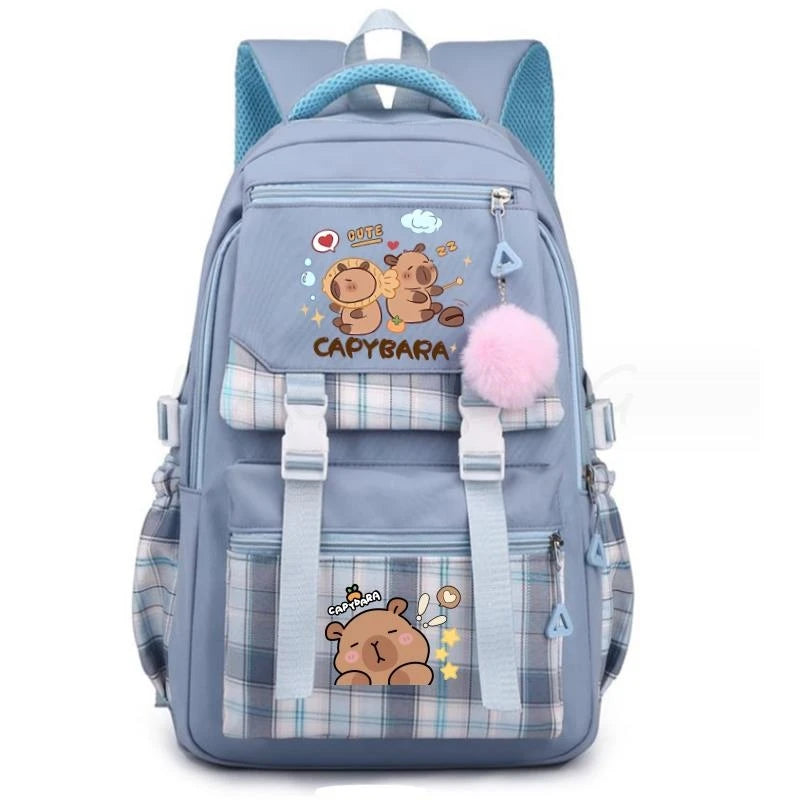 A light blue canvas backpack featuring a cute capybara print and pink fluffy trim.