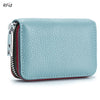 Light blue genuine leather accordion card holder wallet with a zippered closure and red trim.