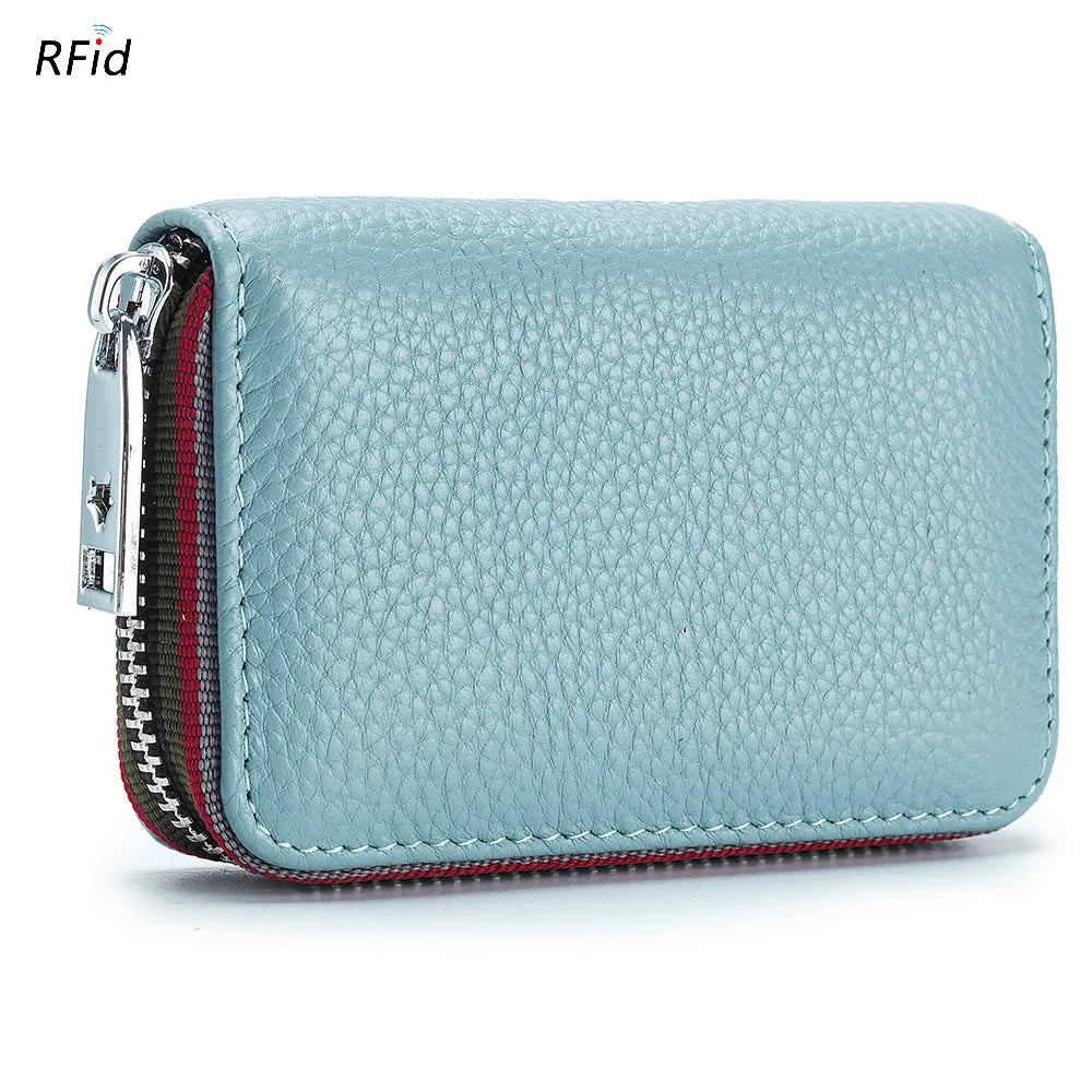 Light blue genuine leather accordion card holder wallet with a zippered closure and red trim.