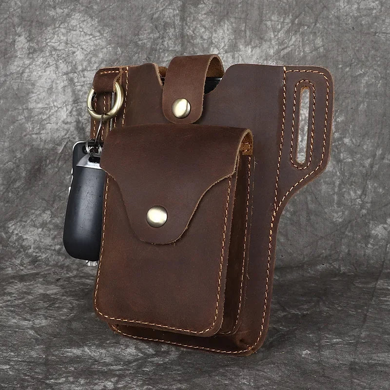 A brown genuine leather men's waist bag with a flap and a metal clip is shown against a dark gray background.