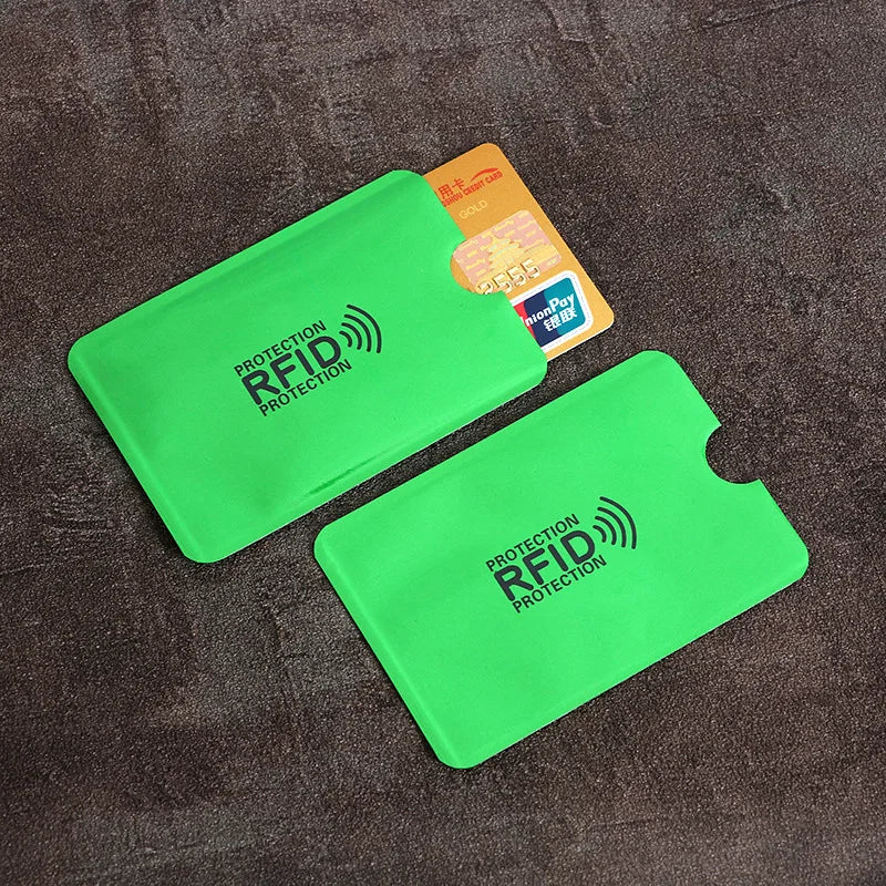 A bright green card sleeve protecting an ID card, with a yellow RFID card visible nearby.