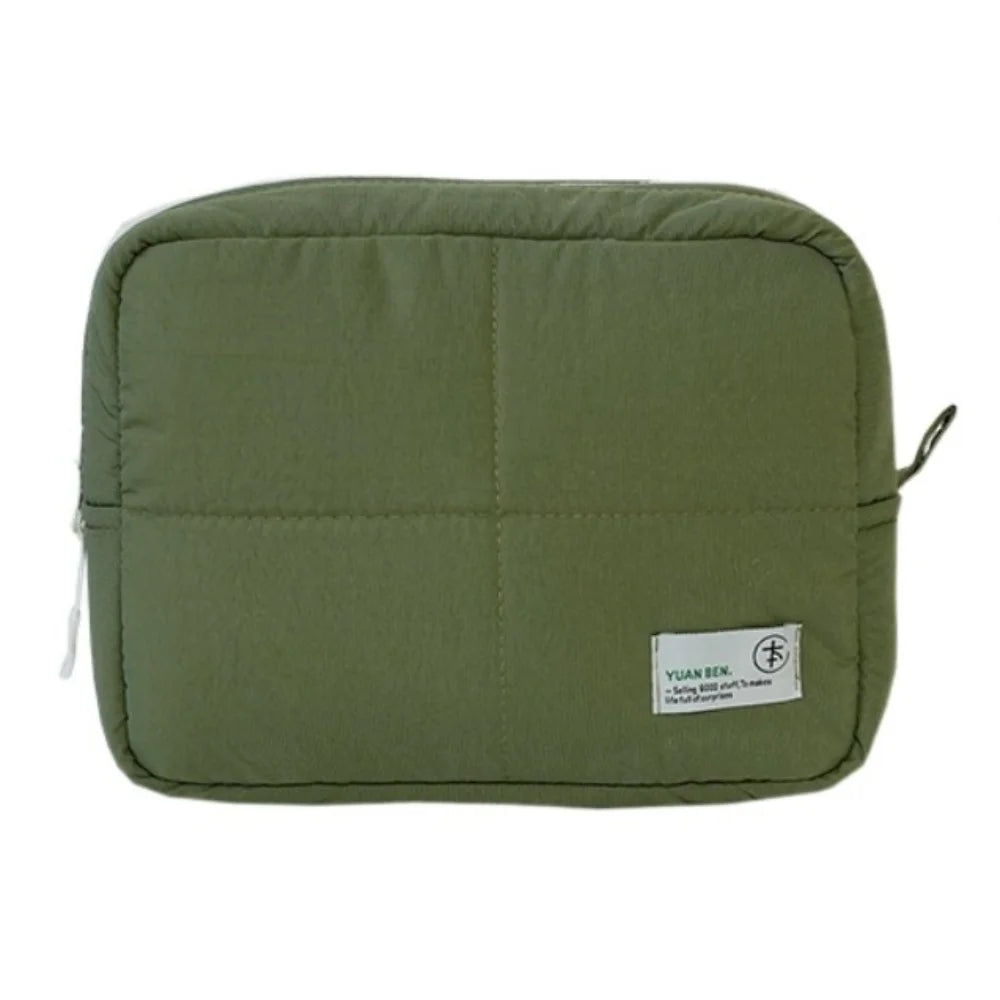 Olive green aesthetic quilted puffer makeup bag with a small tag