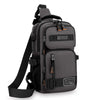 A dark gray multifunctional chest bag with black straps and orange accents, shown from the back.