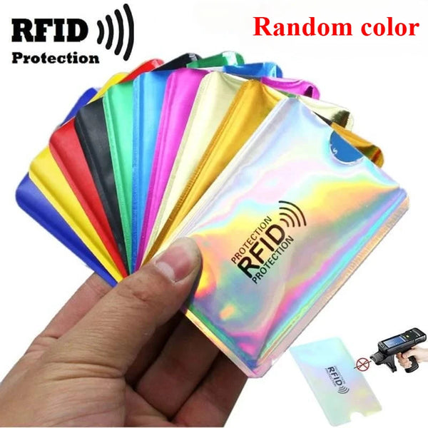 A hand holds a stack of colorful RFID blocking card sleeves and an RFID chip.