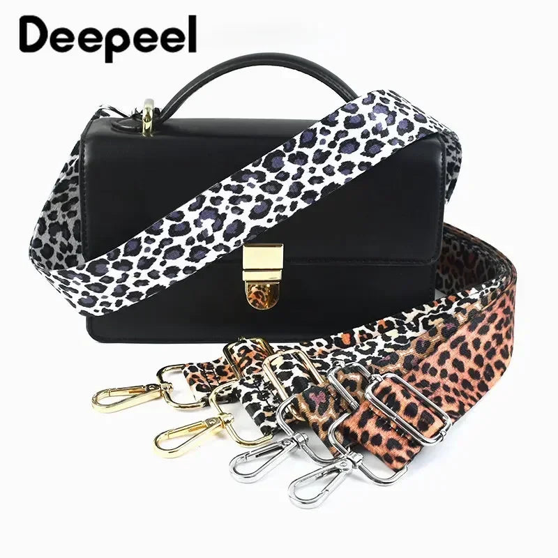 Black handbag with a leopard print adjustable strap and gold hardware