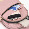 A pink quilted crossbody sling bag with a gold zipper, showing a smartphone inside.