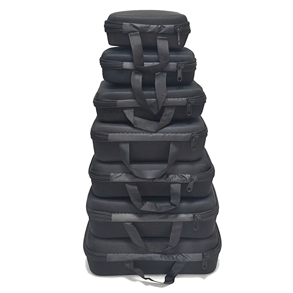 A stack of black portable EVA storage and travel organizer bags.