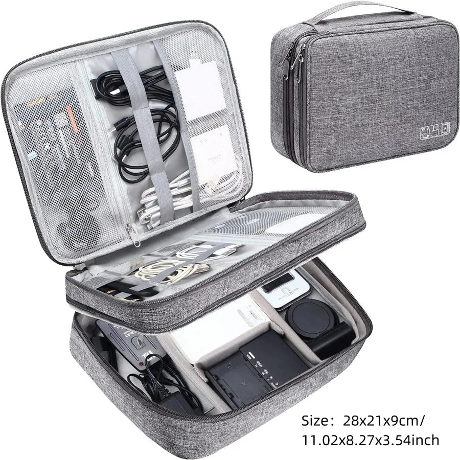 A gray portable digital organizer storage pouch with a zippered compartment and an open section showing various electronic ac