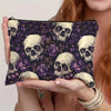 A dark purple and black makeup organizer featuring a pattern of skulls and roses.