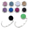 A set of metal desk hooks designed for hanging bags and garments, featuring various glitter and shimmer colors.