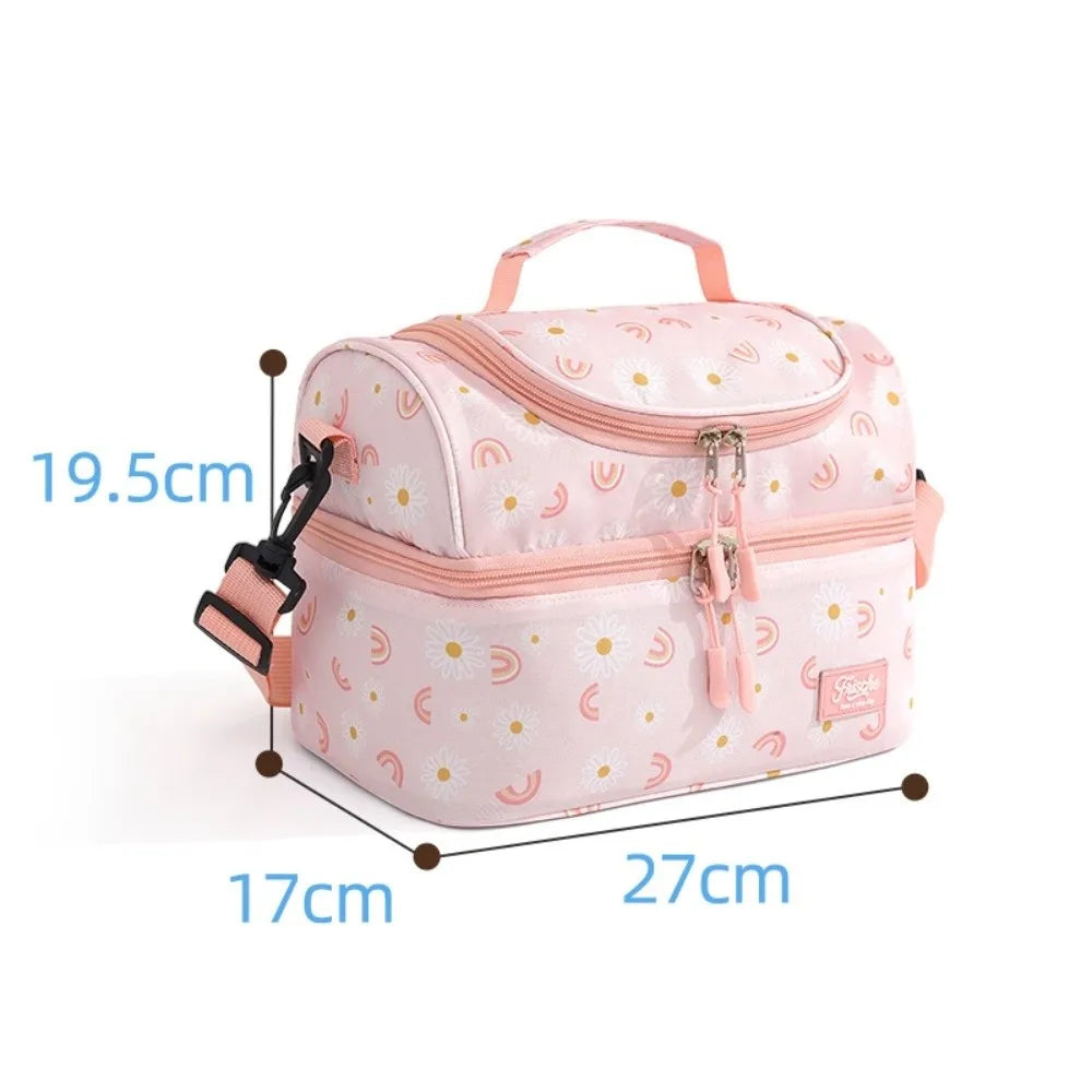 Pink insulated double-layer lunch bag for kids with cute cartoon prints shown from the top.