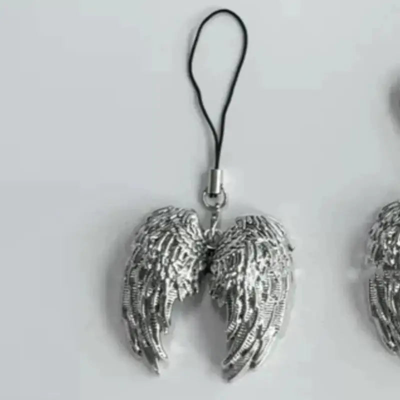 Silver metal angel wing keychain charm with a black cord and clasp.