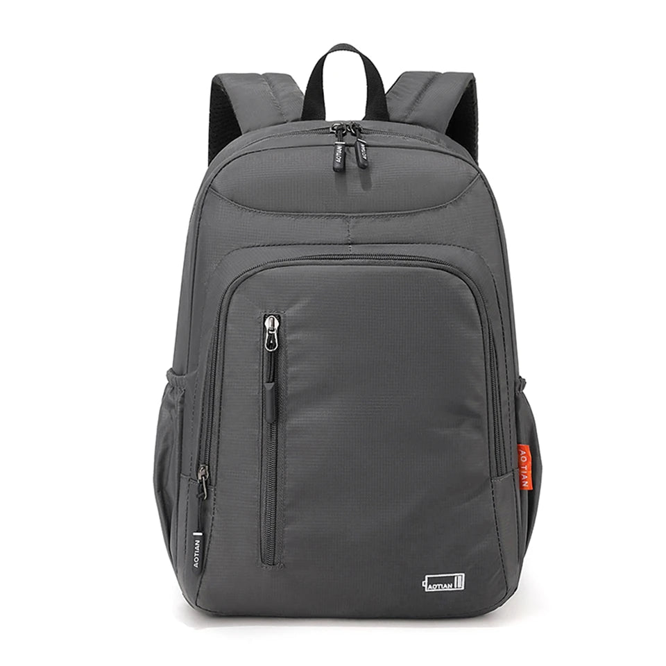 A gray fashion commuter daypack for women with padded straps and a main compartment.
