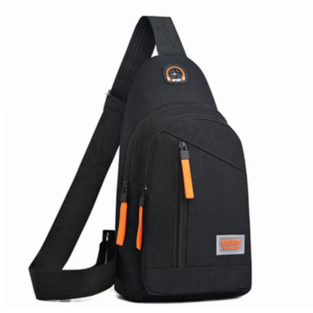 Black lightweight oxford cloth crossbody bag with orange accents shown from the back.