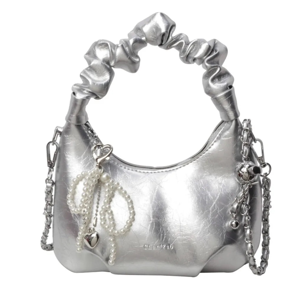 Clutch de noche con lazo brillante plateado y correa de cadena