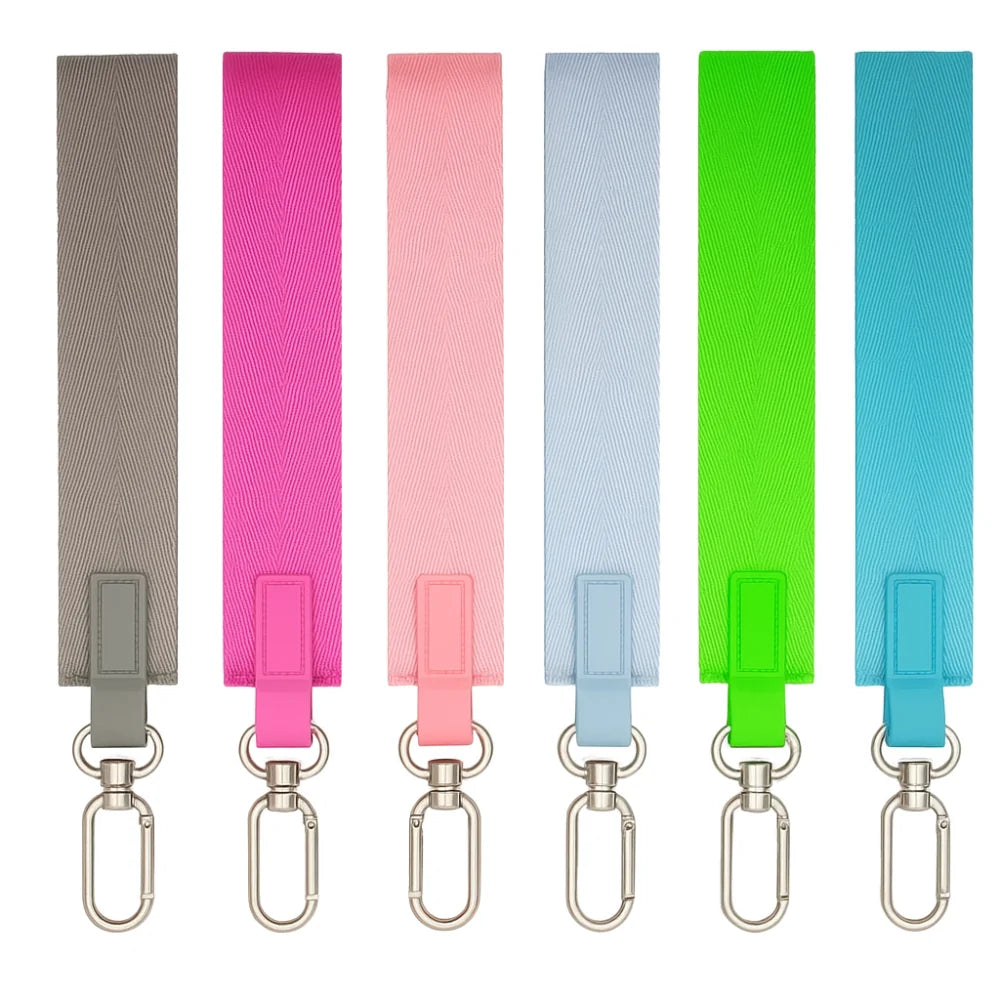 A set of five multicolor nylon wrist strap keychains in shades of gray, pink, blue, and green.