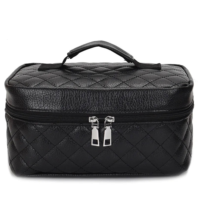 Black leather makeup storage pouch with a handle and zipper.