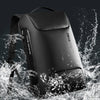 A black laptop backpack is shown being splashed by water droplets against a dark background.