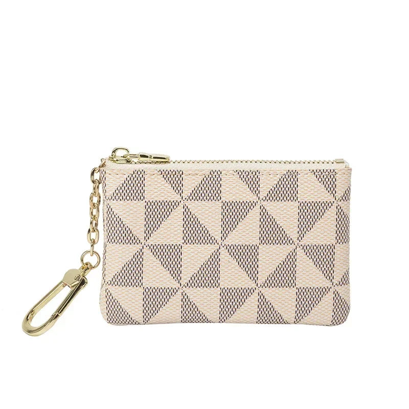 A beige geometric mini coin purse with a checkered pattern and a gold chain.