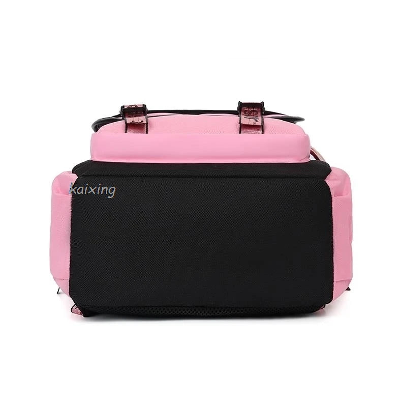 A pink and black canvas backpack with brown leather straps.