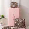 A pink large capacity waterproof travel makeup organizer bag with a leopard print exterior and matching case.