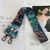 A close-up of a patterned blue and orange adjustable strap for handbags.