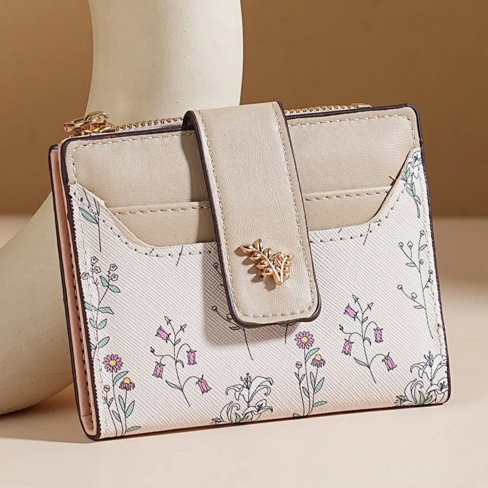 A beige fashion PU leather slim card holder wallet with floral embroidery and a gold zipper detail.