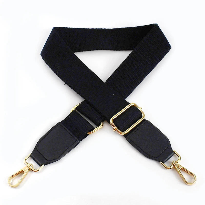 Black canvas cotton bag strap with gold metal hooks, shown in an X-shape.