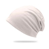 A light gray slouchy knit beanie hat shown from the side.