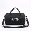Sac de voyage et de sport noir polyvalent avec une sangle noire.