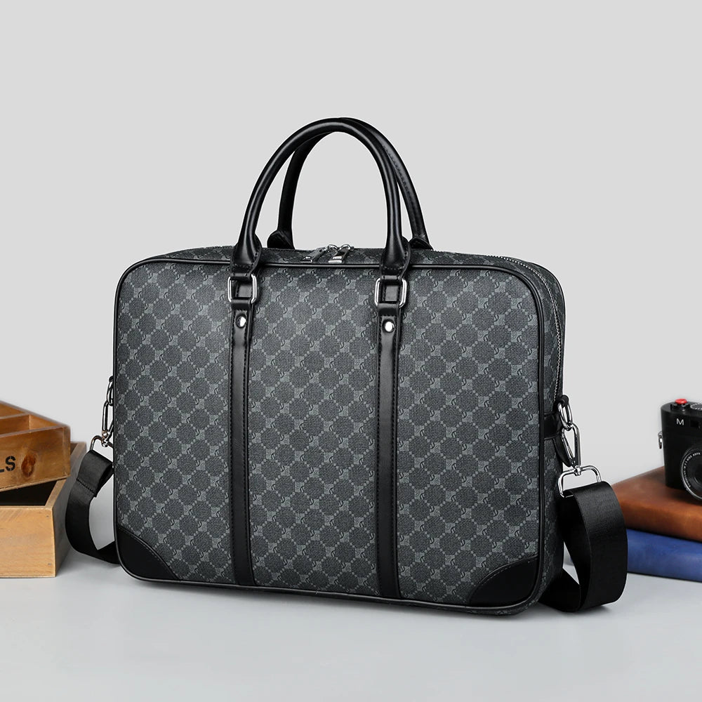 A black executive PU leather laptop briefcase with a shoulder strap is shown on a light gray surface.
