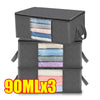 Three gray foldable storage bags filled with various colored fabric items.