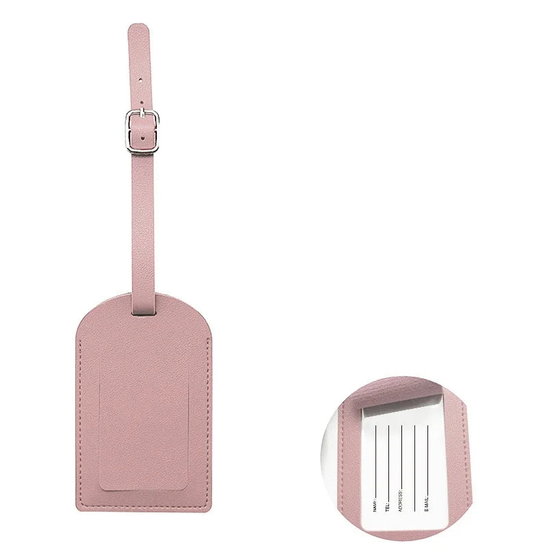 A pink PU leather luggage tag with a rectangular card holder attached to a strap.