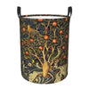 A vintage floral laundry hamper with a dark green and gold pattern featuring birds and fruit.