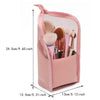 A pink mesh storage case for makeup brushes with a drawstring closure.