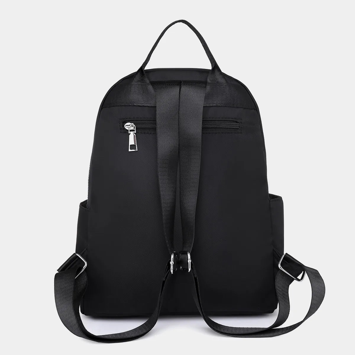 A black waterproof women's travel backpack shown from the back.