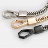 Three metal bag chain straps in silver, gold, and black finishes displayed against a white background.